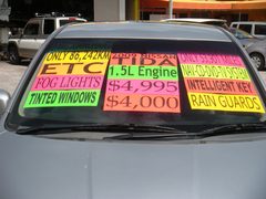 2009 NISSAN TIDA, windshield with the price signs