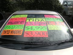 2009 NISSAN TIDA, windshield with the price signs