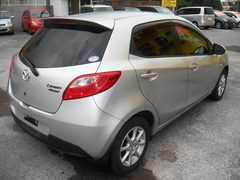 2011 MAZDA DEMIO, rear three-quarter view